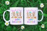 Two Halloween-themed mugs with skeletons and pumpkins on a grass background.