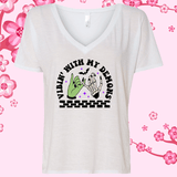 White V-neck t-shirt with graphic design and text on a pink floral background