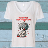 White V-neck t-shirt with a cartoon voodoo doll graphic and text on a blue wooden background