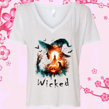 White V-neck t-shirt with a Halloween-themed design featuring a witch, pumpkin, and the word 'Wicked' on a pink floral background.